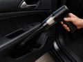 Meonix CleanForce Mini handheld vacuum cleaner with a sleek black design and compact size for easy cleaning.